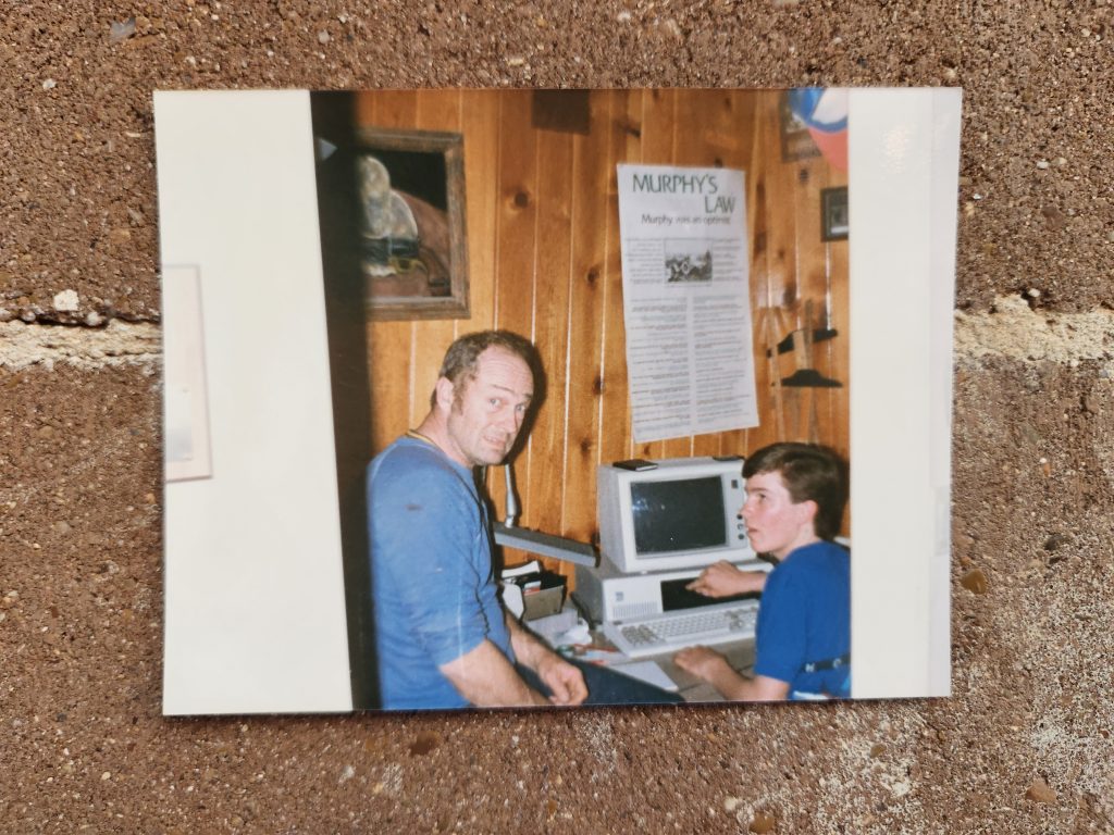 Picture of two people on a computer